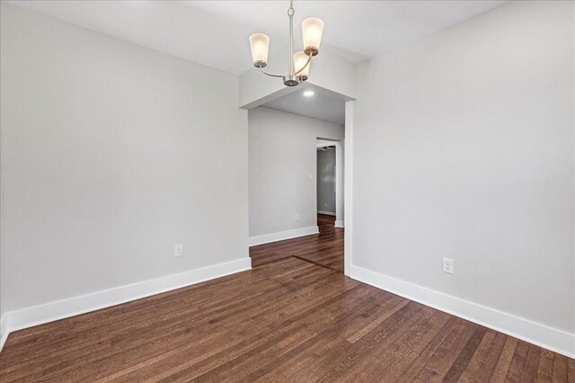 1115 Grantland Ave, Murfreesboro, TN 37129 - spare room with a chandelier, baseboards, and dark wood-style flooring