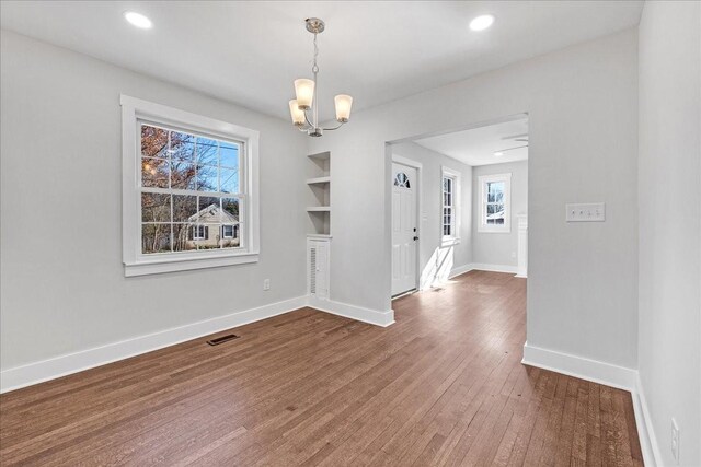 1115 Grantland Ave, Murfreesboro, TN 37129 - unfurnished dining area with a chandelier, wood finished floors, baseboards, and recessed lighting
