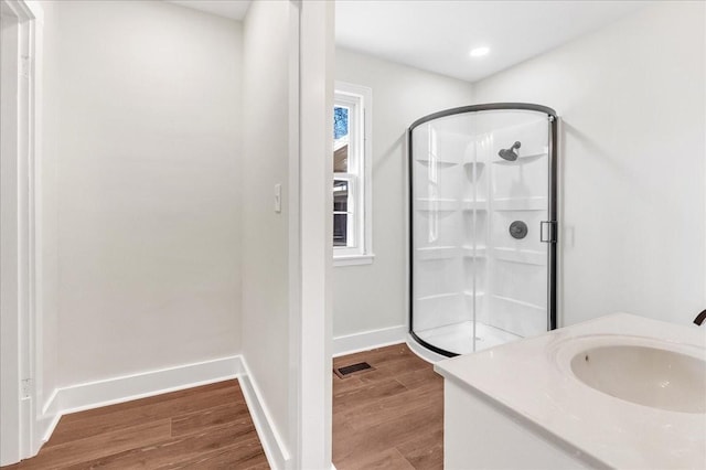1115 Grantland Ave, Murfreesboro, TN 37129 - bathroom with a shower stall, wood finished floors, baseboards, and vanity