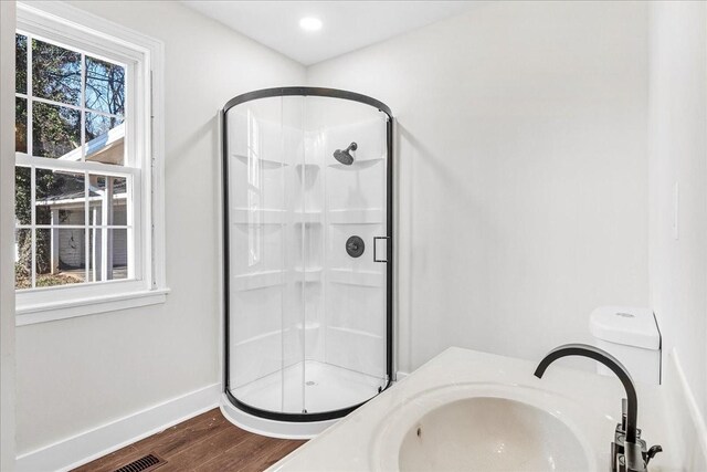 1115 Grantland Ave, Murfreesboro, TN 37129 - full bath with a stall shower, wood finished floors, a sink, and baseboards