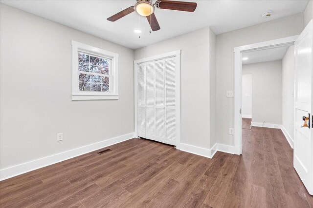 1115 Grantland Ave, Murfreesboro, TN 37129 - unfurnished bedroom featuring a closet, wood finished floors, baseboards, and a ceiling fan