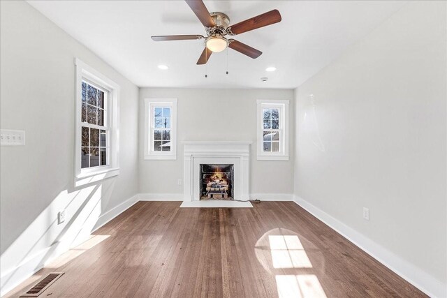 1115 Grantland Ave, Murfreesboro, TN 37129 - unfurnished living room with a fireplace with flush hearth, baseboards, wood finished floors, a ceiling fan, and recessed lighting