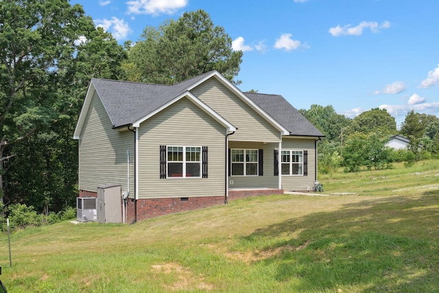 1505 Bakers Work Rd, Burns, TN 37029 - back of property with crawl space, a yard, roof with shingles, and central air condition unit