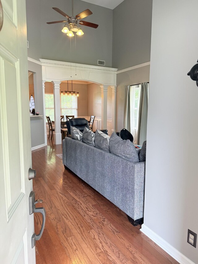 2415 Saint Andrews Dr, Murfreesboro, TN 37128 - living room with ornate columns, a high ceiling, wood finished floors, and healthy amount of natural light