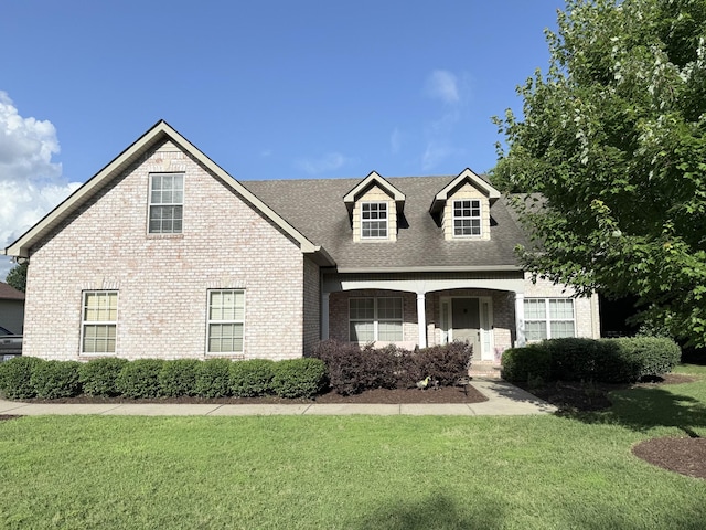 2415 Saint Andrews Dr, Murfreesboro, TN 37128 - view of front facade with brick siding, a front yard, roof with shingles, and a porch