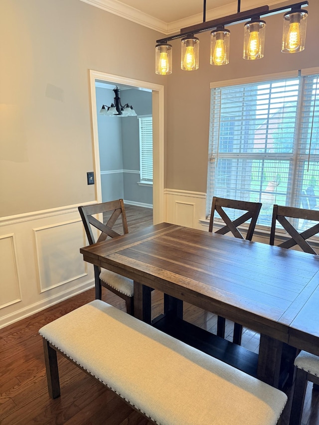 2415 Saint Andrews Dr, Murfreesboro, TN 37128 - dining space featuring a decorative wall, crown molding, wainscoting, dark wood finished floors, and a chandelier