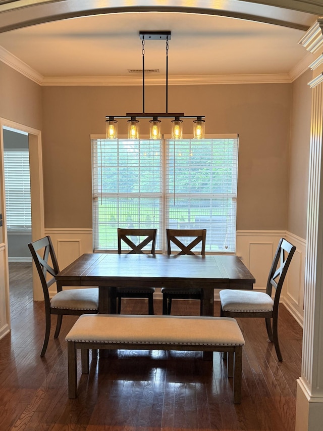 2415 Saint Andrews Dr, Murfreesboro, TN 37128 - dining area with dark wood-style floors, ornamental molding, wainscoting, a decorative wall, and arched walkways