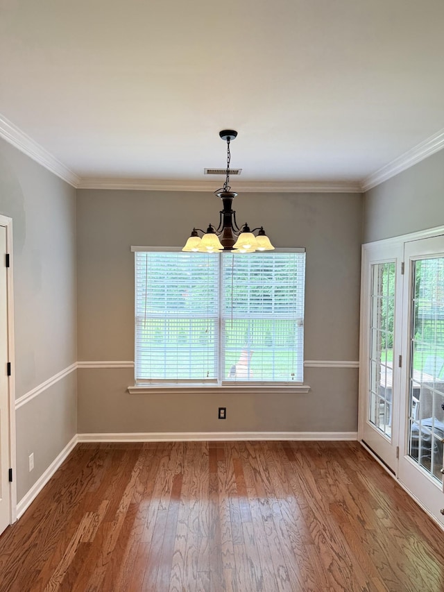 2415 Saint Andrews Dr, Murfreesboro, TN 37128 - unfurnished room with healthy amount of natural light, wood finished floors, crown molding, and a chandelier