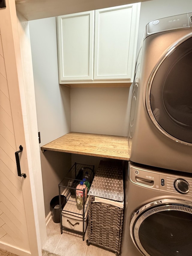 2415 Saint Andrews Dr, Murfreesboro, TN 37128 - laundry room with stacked washer / drying machine and cabinet space