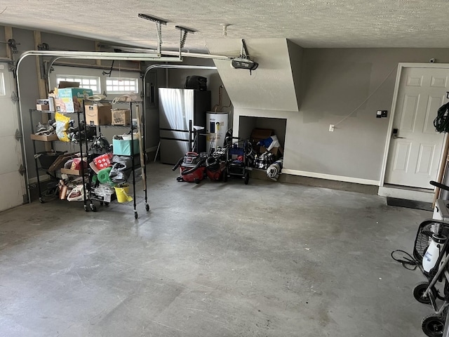 2415 Saint Andrews Dr, Murfreesboro, TN 37128 - garage featuring refrigerator, water heater, and a garage door opener
