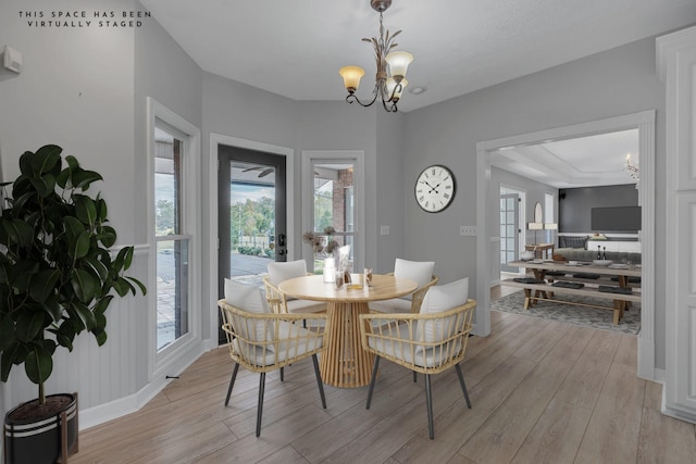 2103 Liebengood Rd, Goodlettsville, TN 37072 - dining area with a chandelier, light wood finished floors, and healthy amount of natural light