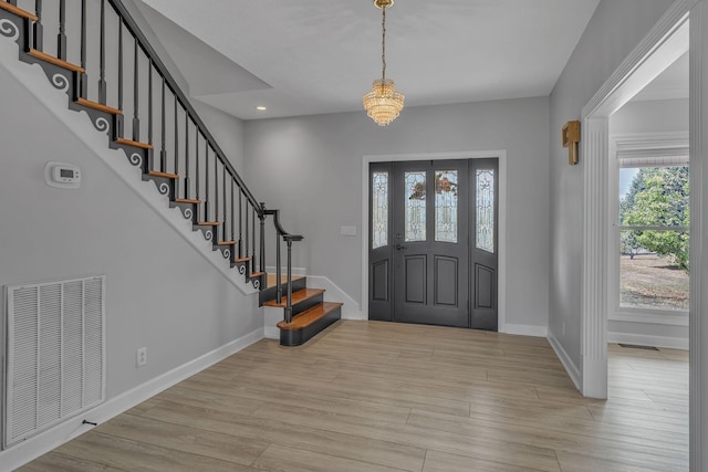 2103 Liebengood Rd, Goodlettsville, TN 37072 - entrance foyer featuring baseboards, stairs, light wood-style floors, recessed lighting, and a chandelier