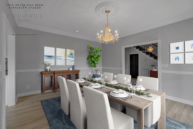 2103 Liebengood Rd, Goodlettsville, TN 37072 - dining space featuring a chandelier, light wood finished floors, crown molding, baseboards, and stairs