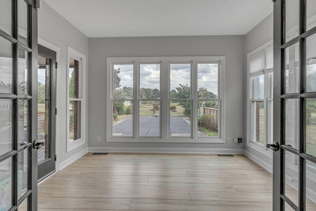2103 Liebengood Rd, Goodlettsville, TN 37072 - unfurnished sunroom featuring french doors and plenty of natural light