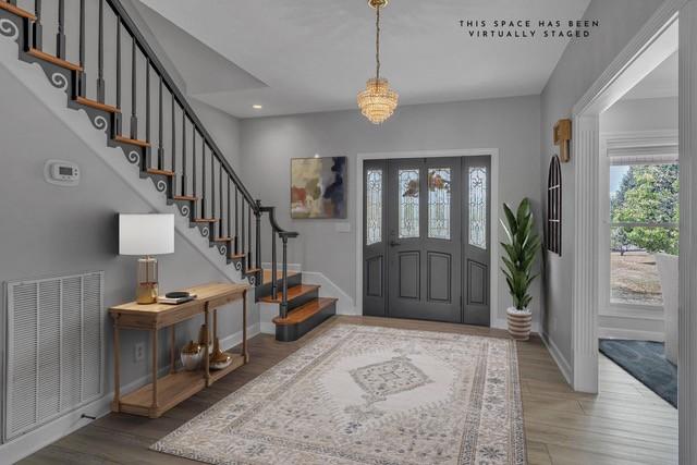 2103 Liebengood Rd, Goodlettsville, TN 37072 - foyer featuring stairs, baseboards, wood finished floors, recessed lighting, and a chandelier