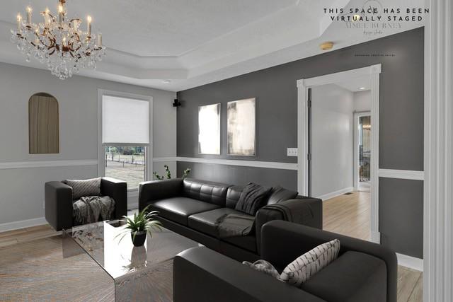 2103 Liebengood Rd, Goodlettsville, TN 37072 - living room featuring a tray ceiling, a chandelier, baseboards, and light wood-type flooring
