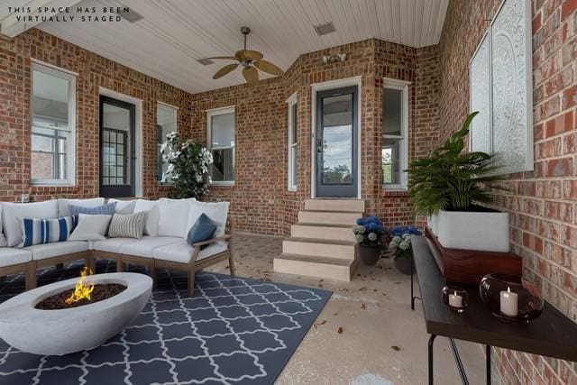 2103 Liebengood Rd, Goodlettsville, TN 37072 - view of patio with a ceiling fan and an outdoor living space with a fire pit