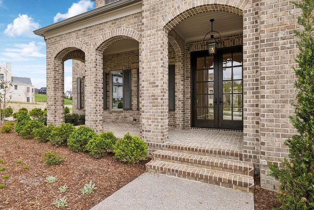 9314 Double Run Ct, College Grove, TN 37046 - view of exterior entry featuring french doors and brick siding