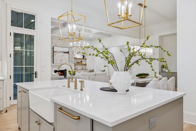 9314 Double Run Ct, College Grove, TN 37046 - kitchen with a chandelier, a sink, open floor plan, light wood-type flooring, and coffered ceiling