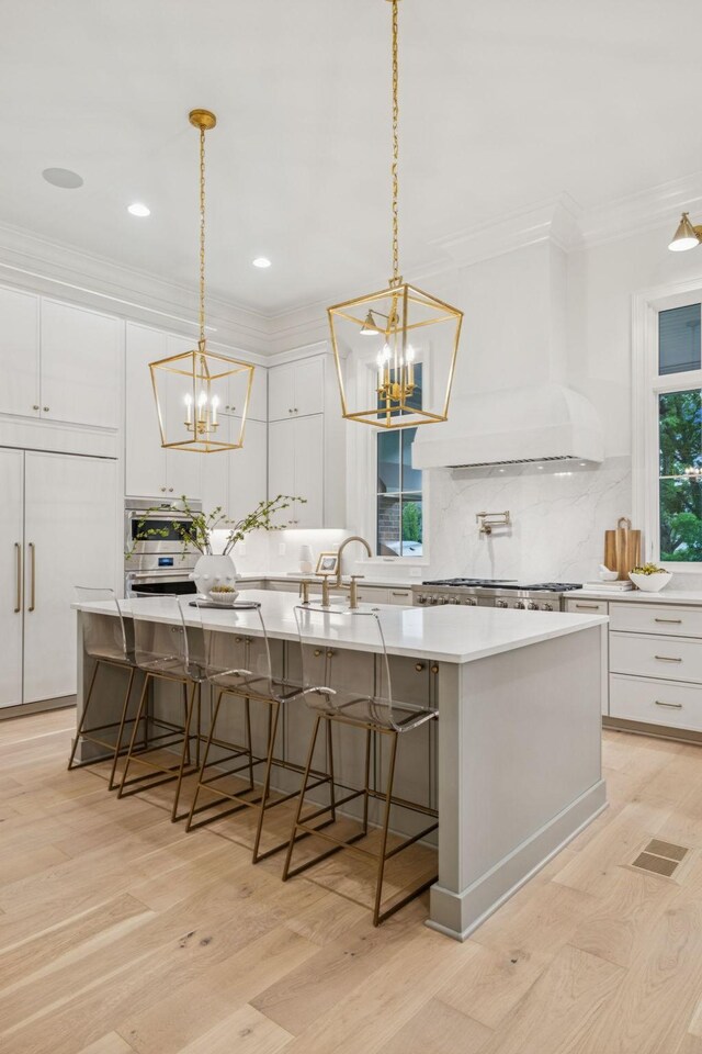 9314 Double Run Ct, College Grove, TN 37046 - kitchen with a sink, a chandelier, backsplash, ornamental molding, and recessed lighting