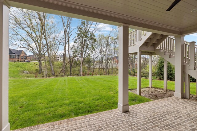 9314 Double Run Ct, College Grove, TN 37046 - view of grassy yard featuring stairs, ceiling fan, and a patio