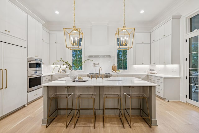 9314 Double Run Ct, College Grove, TN 37046 - kitchen featuring a chandelier, paneled built in fridge, double oven, light wood-style flooring, and light countertops