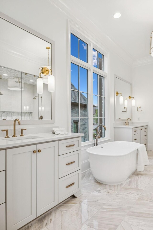 9314 Double Run Ct, College Grove, TN 37046 - bathroom with two vanities, crown molding, a soaking tub, a shower stall, and marble tiled floors