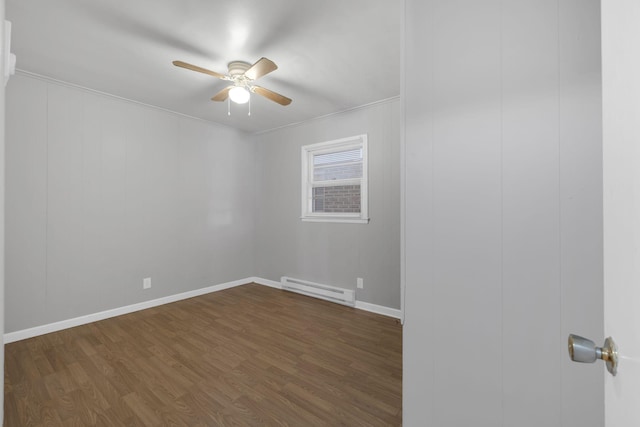 123 S Sam Davis Ave, Pulaski, TN 38478 - empty room featuring a baseboard radiator, a ceiling fan, dark wood-type flooring, ornamental molding, and baseboards