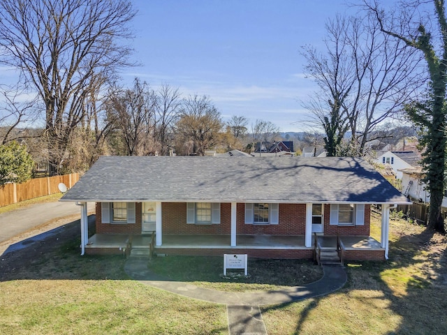 123 S Sam Davis Ave, Pulaski, TN 38478 - view of front facade featuring covered porch, brick siding, and a shingled roof