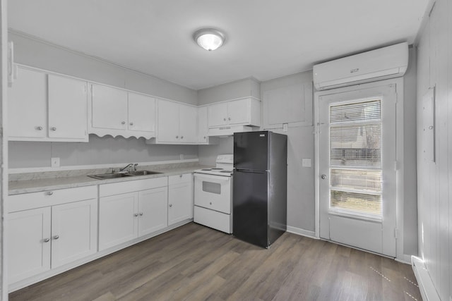 123 S Sam Davis Ave, Pulaski, TN 38478 - kitchen with white electric range oven, a sink, freestanding refrigerator, a wall unit AC, and under cabinet range hood