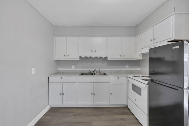 123 S Sam Davis Ave, Pulaski, TN 38478 - kitchen featuring freestanding refrigerator, white electric range, a sink, white cabinets, and light countertops