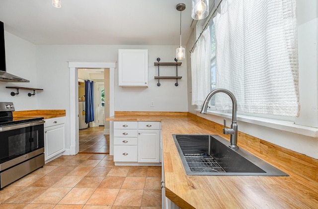 213 Maple St, Bell Buckle, TN 37020 - kitchen with stainless steel electric stove, butcher block countertops, a sink, and plenty of natural light