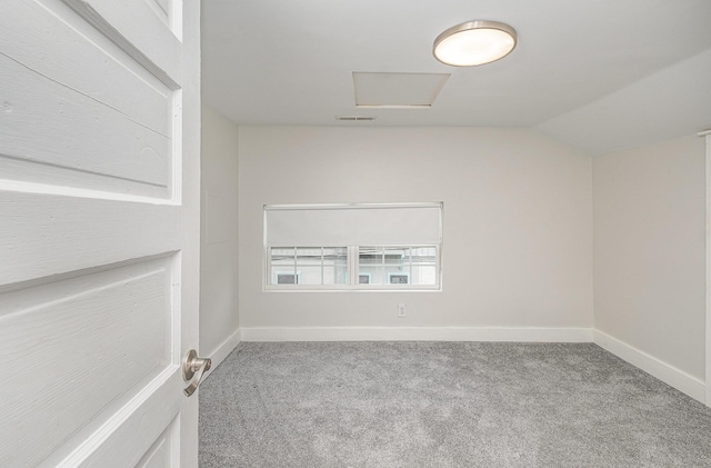213 Maple St, Bell Buckle, TN 37020 - carpeted empty room featuring attic access, vaulted ceiling, and baseboards