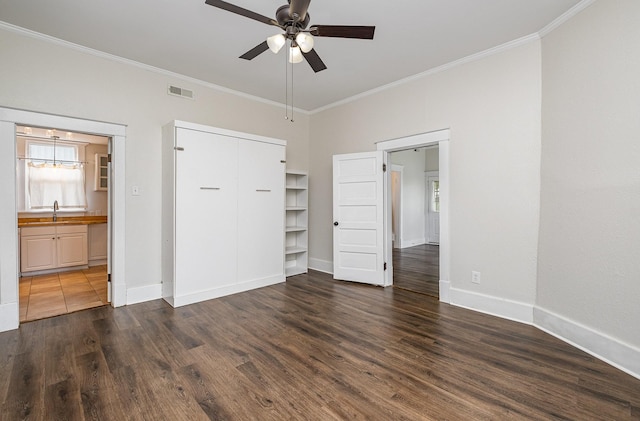 213 Maple St, Bell Buckle, TN 37020 - unfurnished bedroom with crown molding, baseboards, dark wood finished floors, connected bathroom, and ceiling fan