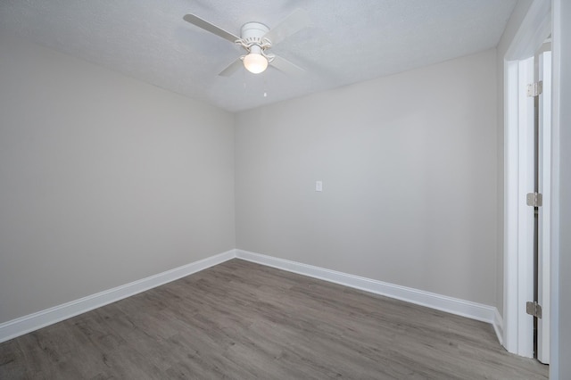 201 Welker Rd, Cedar Hill, TN 37032 - spare room with wood finished floors, a ceiling fan, and baseboards