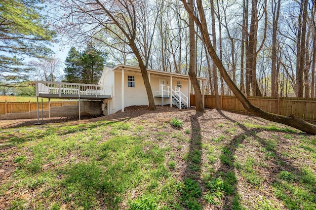 201 Welker Rd, Cedar Hill, TN 37032 - back of property with a fenced backyard, a wooden deck, and stairs