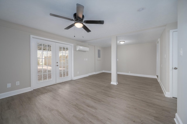 201 Welker Rd, Cedar Hill, TN 37032 - unfurnished living room featuring a wall mounted AC, french doors, wood finished floors, baseboards, and ceiling fan