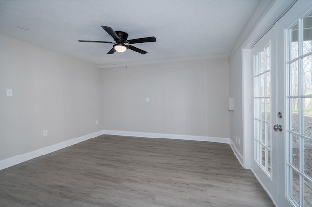 201 Welker Rd, Cedar Hill, TN 37032 - spare room with baseboards, wood finished floors, a ceiling fan, and french doors