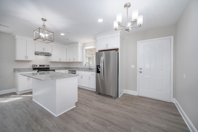 201 Welker Rd, Cedar Hill, TN 37032 - kitchen featuring appliances with stainless steel finishes, a chandelier, under cabinet range hood, baseboards, and recessed lighting