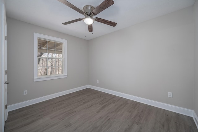 201 Welker Rd, Cedar Hill, TN 37032 - spare room with dark wood-style floors, baseboards, and ceiling fan