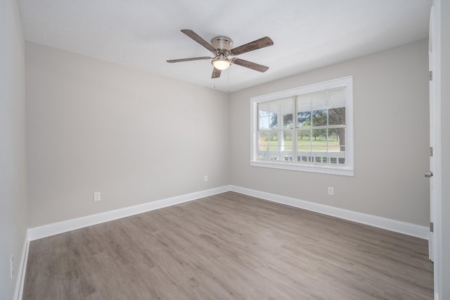 201 Welker Rd, Cedar Hill, TN 37032 - unfurnished room with wood finished floors, a ceiling fan, and baseboards