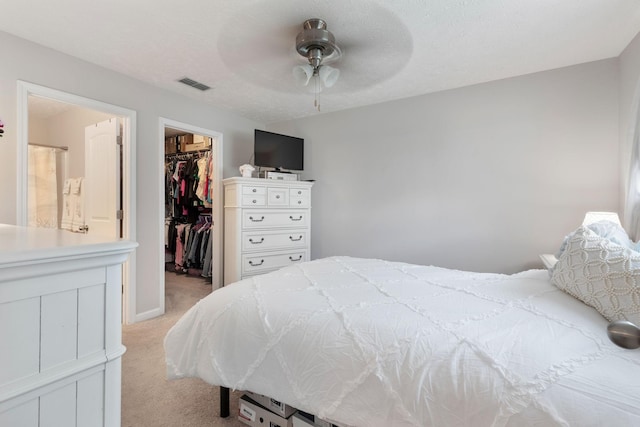 5104 Preserve Blvd, Antioch, TN 37013 - bedroom featuring a walk in closet, light carpet, a closet, and a ceiling fan