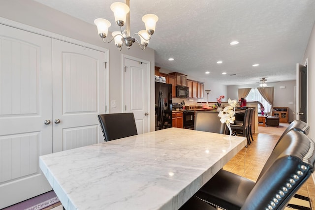5104 Preserve Blvd, Antioch, TN 37013 - dining area with a chandelier, recessed lighting, and a textured ceiling