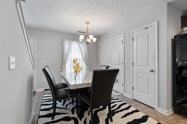 5104 Preserve Blvd, Antioch, TN 37013 - dining area featuring a chandelier, baseboards, a textured ceiling, and light tile patterned floors