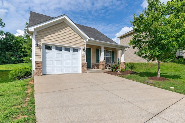 5104 Preserve Blvd, Antioch, TN 37013 - view of front of property with concrete driveway, a porch, an attached garage, a front lawn, and stone siding
