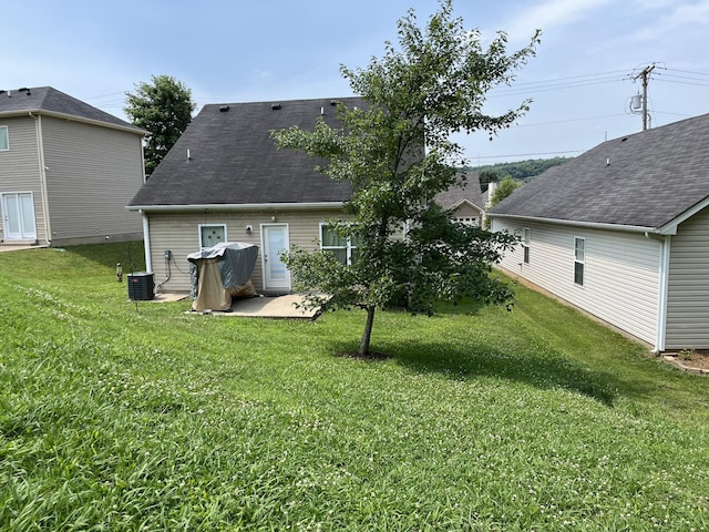 5104 Preserve Blvd, Antioch, TN 37013 - rear view of house with a lawn and a patio