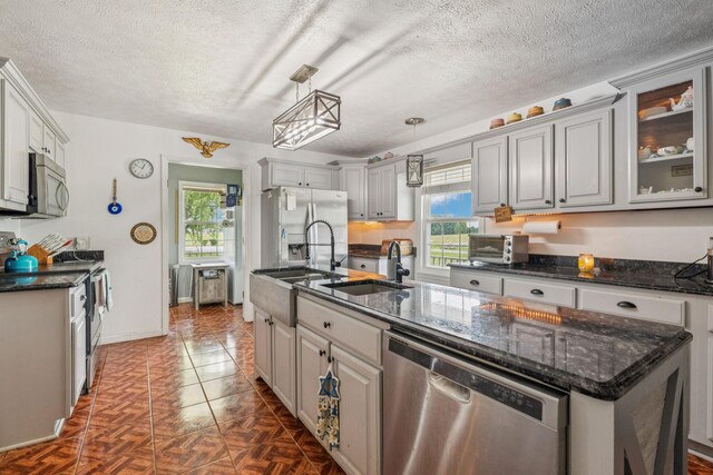 834 Union Camp Rd, Lafayette, TN 37083 - kitchen featuring appliances with stainless steel finishes, healthy amount of natural light, a sink, and a textured ceiling