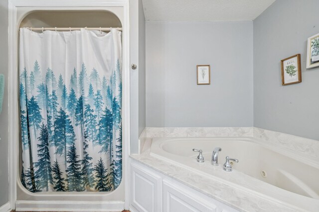 834 Union Camp Rd, Lafayette, TN 37083 - full bathroom with a jetted tub, a shower with shower curtain, and a textured ceiling