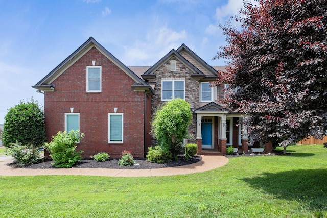 5000 Loch Lorne Ct, Mount Juliet, TN 37122 - craftsman house with a front lawn, brick siding, and stone siding