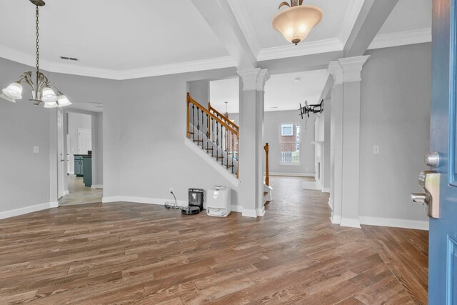 5000 Loch Lorne Ct, Mount Juliet, TN 37122 - entrance foyer with decorative columns, stairway, a chandelier, wood finished floors, and ornamental molding